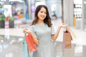 The young girl was happily showing off what she just bought photo