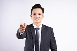 Image of young Asian businessman wearing suit on white background photo