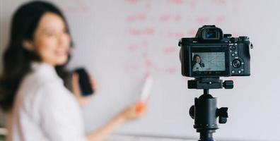 Asian female teachers are recording lessons for online teaching work photo