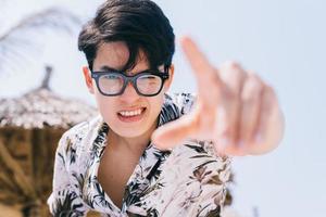 Portrait of Asian man on the beach photo