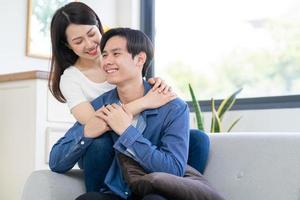 Young Asian couple chatting happily photo