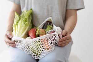 Vegetables arrangement in a textile bag photo
