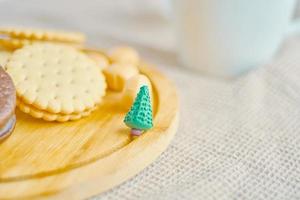 Cookies and cakes on a wooden tray. photo