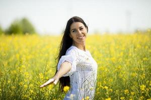 Young woman in the rapeseed field photo