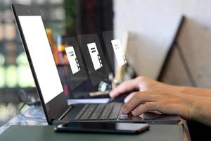 Businessman hand working on laptop computer and network and data connection , work from home concept, marketing plan concept photo