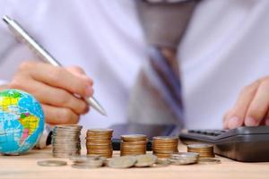 coins on table background and saving money and business growth concept, finance and investment concept, stack of coin on table and saving money photo