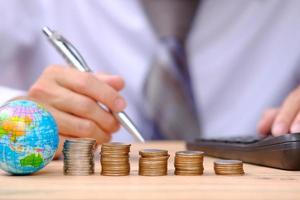 coins on table background and saving money and business growth concept, finance and investment concept, stack of coin on table and saving money photo