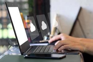 Businessman hand working on laptop computer and network and data connection , work from home concept, marketing plan concept photo