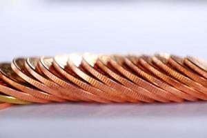 stack of coin on table background and saving money and business growth concept, finance and investment concept photo