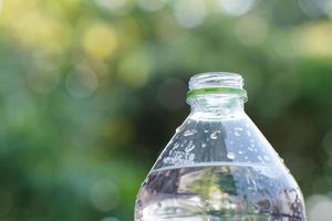 drinking water on wood table and space for text photo