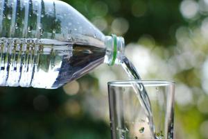 drinking water on wood table and space for text photo