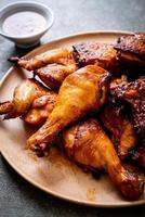Grilled and barbecue chicken on a table photo