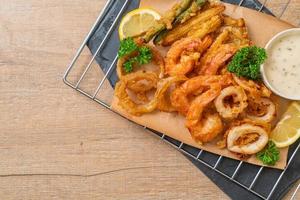 Deep-fried seafood of shrimp and squid with mix vegetables - unhealthy food style