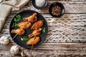 Grilled chicken wings barbecue with pepper and garlic photo