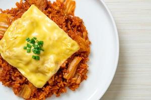 Kimchi fried rice with pork and topped cheese - Asian and fusion food style photo