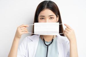 Female doctor instructing to wear a mask properly photo