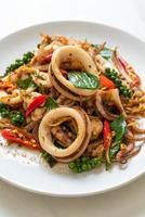 Stir-fried holy basil with octopus or squid and herb - Asian food style photo