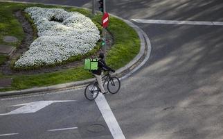 Bicycle messenger on the streets of Madrid, Spain photo