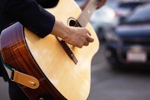 Close up hand playing Acoustic guitar catch guitar chords photo