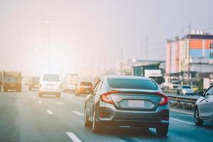 Car Driving on road and Small passenger car seat on the road used for daily trips photo