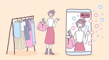 mujeres jóvenes usan teléfonos inteligentes en vivo para vender ropa vector