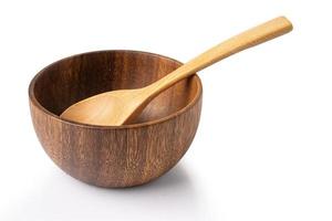 Brown wooden bowl with spoon isolate on white background with clipping path. photo