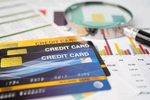 Credit card on chart and graph paper. Finance development, Banking Account, Statistics, Investment Analytic research data economy, Stock exchange trading, Business company concept. photo