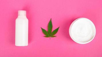 hemp cosmetics on pink background, beauty and skin care photo