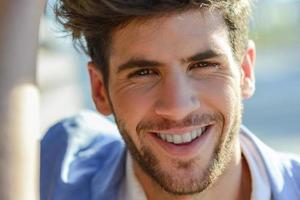 Young man smiling to camera photo