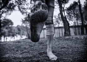 Dirty feet in forest photo