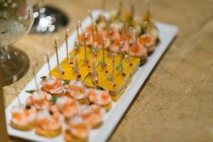 Buffet food, catering food party at restaurant, mini canapes, snacks and appetizers photo