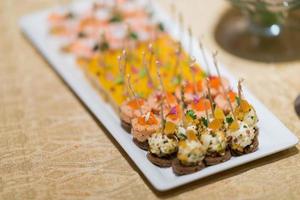 Buffet food, catering food party at restaurant, mini canapes, snacks and appetizers photo