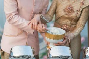 Hot rice, give alms to a Buddhist monk photo