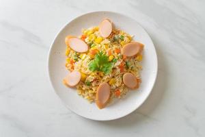 Fried rice with sausage and mixed vegetable photo