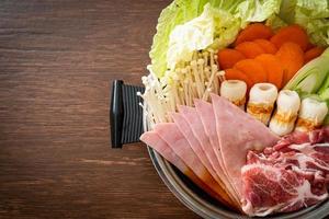 Sukiyaki or shabu hot pot black soup with meat raw and vegetable - Japanese food style photo