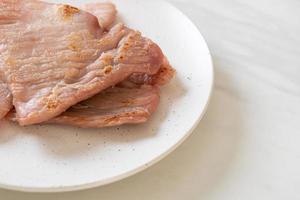 Fried sun-dried pork on plate photo