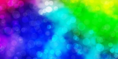 Light Multicolor vector background with circles.