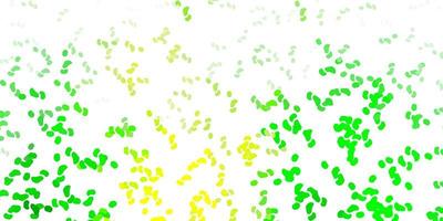 Light green, yellow vector backdrop with chaotic shapes.