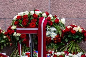 Flower bouquet with Latvian flag. Latvian Independence Day - image photo