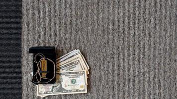USB disk with private data and money on a two-tone textile background. photo