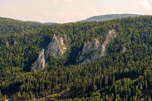 The Austrian Alpine mountain landscape on a hazy autumn day. photo