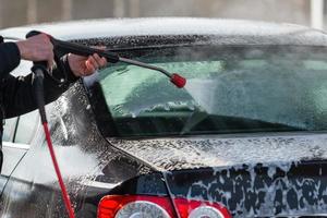 Car without touch washing self-service. Wash with water and foam. photo