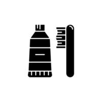 Travel toothbrush black glyph icon. Mini brush and toothpaste. Portable hygiene amenities. Essentials for tourist. Travel size objects. Silhouette symbol on white space. Vector isolated illustration