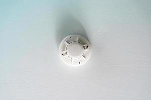 Smoke fire detector, Smoke detector on ceiling photo