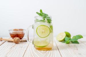 Iced honey and lime soda with mint - refreshing drink