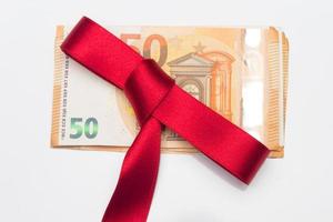 Money with red ribbon photo