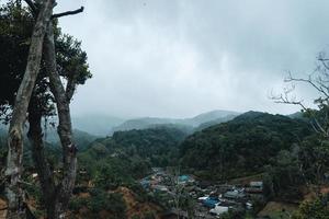 Village in the mountains in the tropical rainforest photo