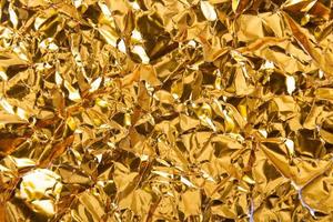 Gold paper crumpled texture background photo