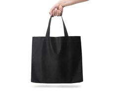 Hand holding black Tote bag isolated on white background with clipping path photo