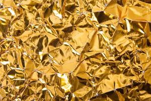 Gold paper crumpled texture background photo